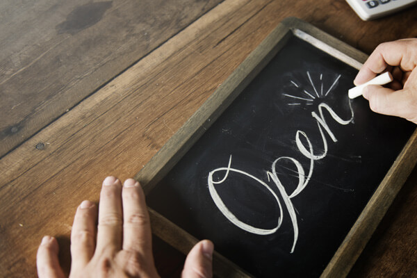 Open sign for business written in chalk
