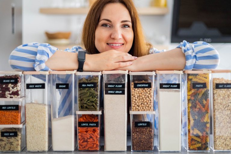 professional organizer showing labeled containers in the kitchen