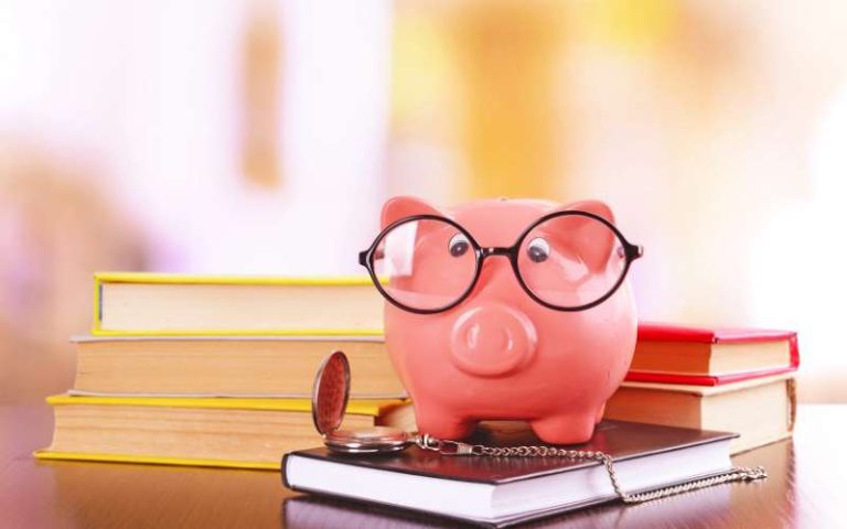 piggy bank on top of a book