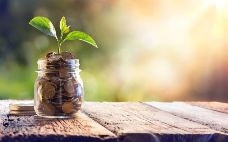 jar of coins in the sun representing sinking funds