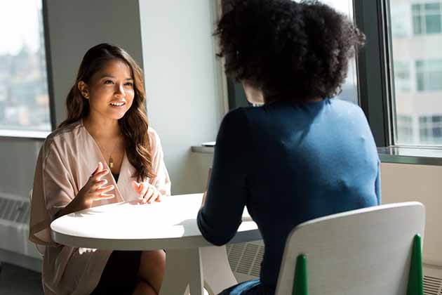 female attorney giving legal advice to black female