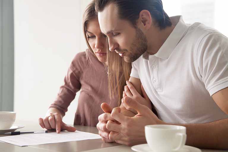 Couple Looking over Health Insurance Plan options